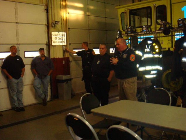 Chief Lee Gillette speaking inside the fire station.